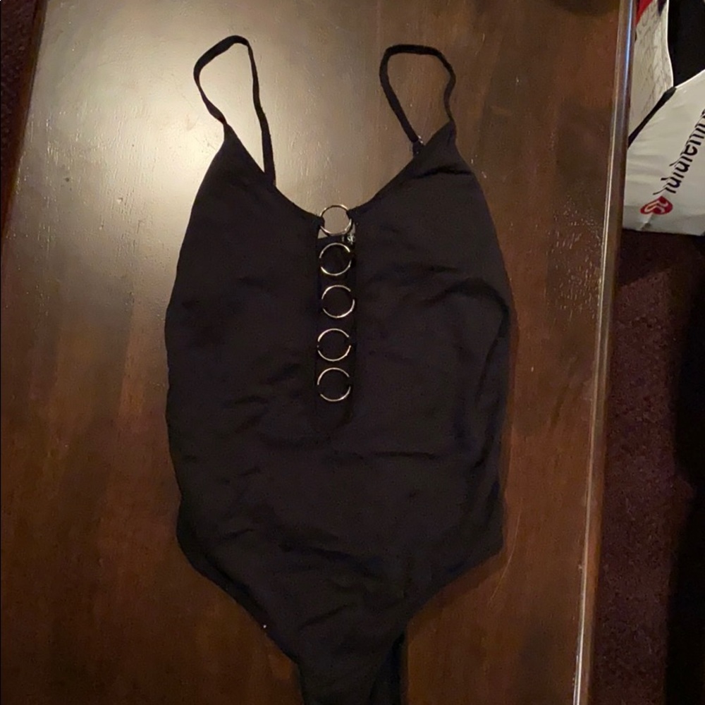 Black ring bodysuit.